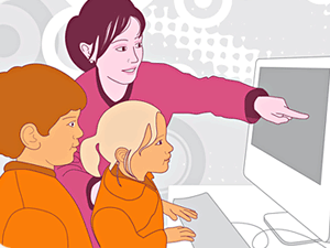 Alumnes amb professora davant l'ordinador. Premi TIC Impuls